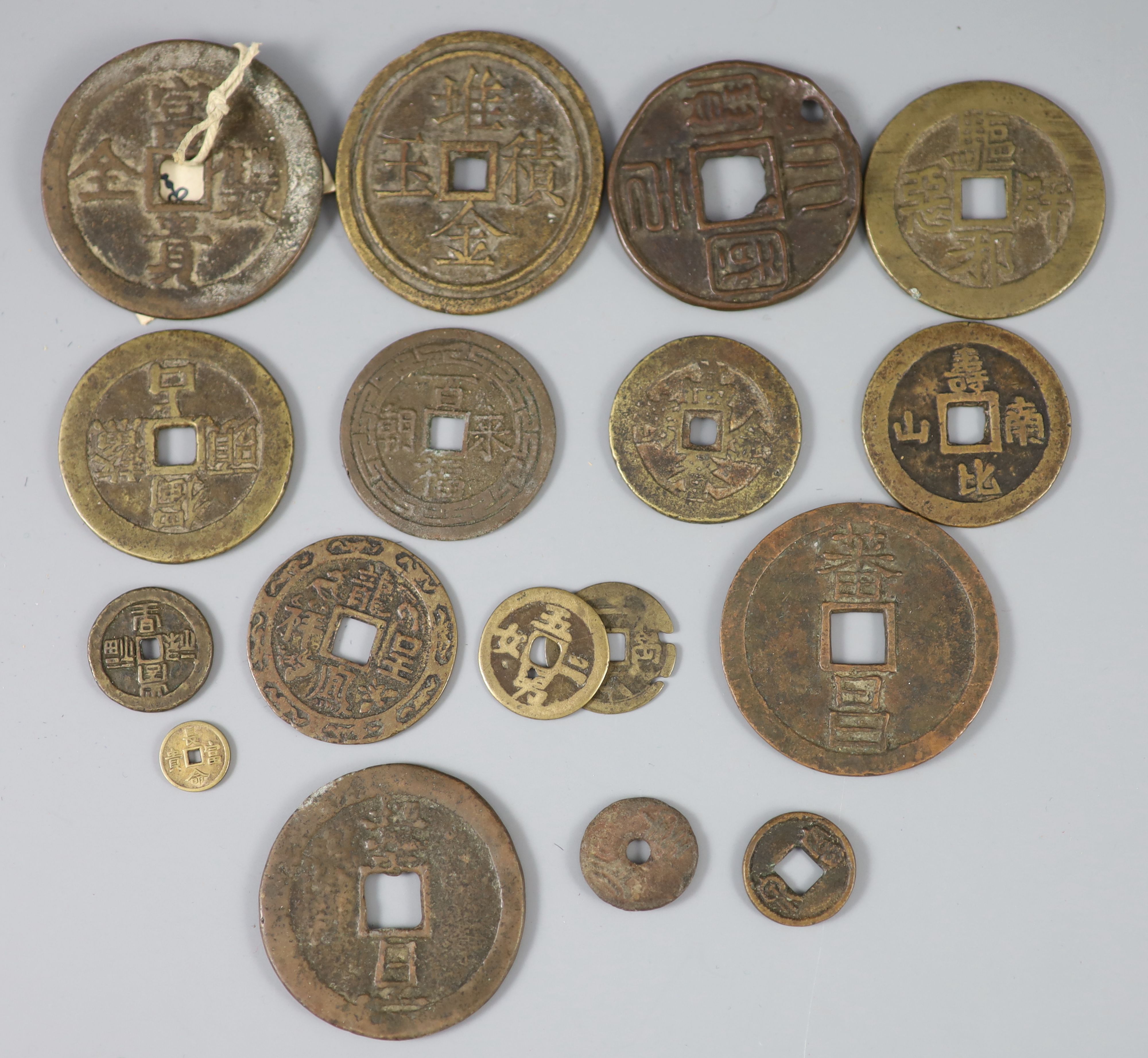 China, 17 bronze or copper charms or amulets, Qing dynasty,